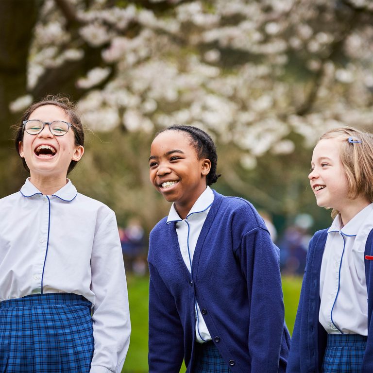 three school girls laughing