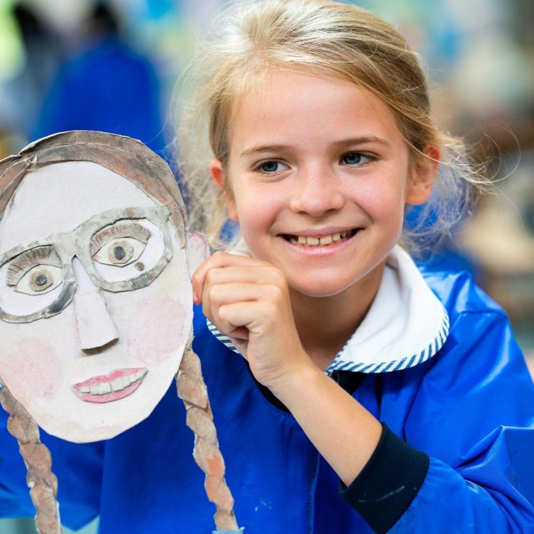 girl holding a mask