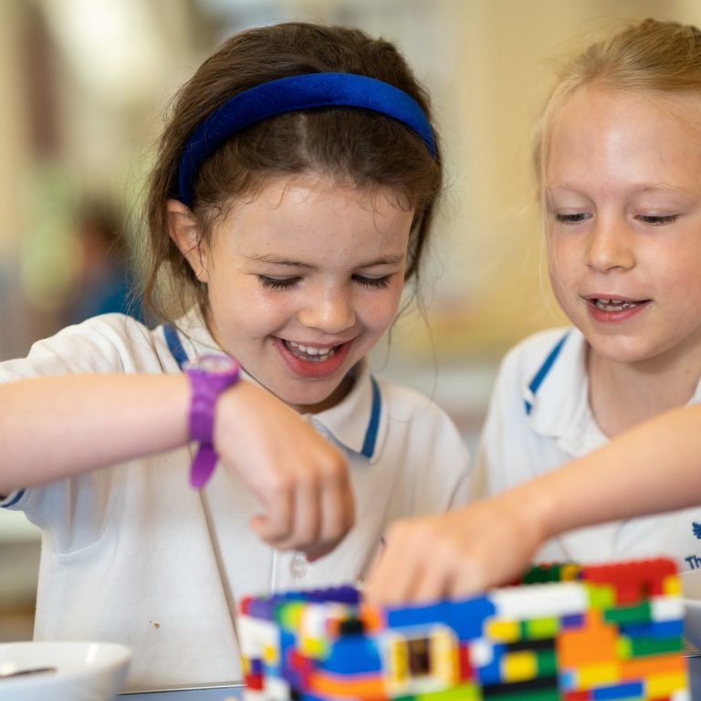 girls playing with lego