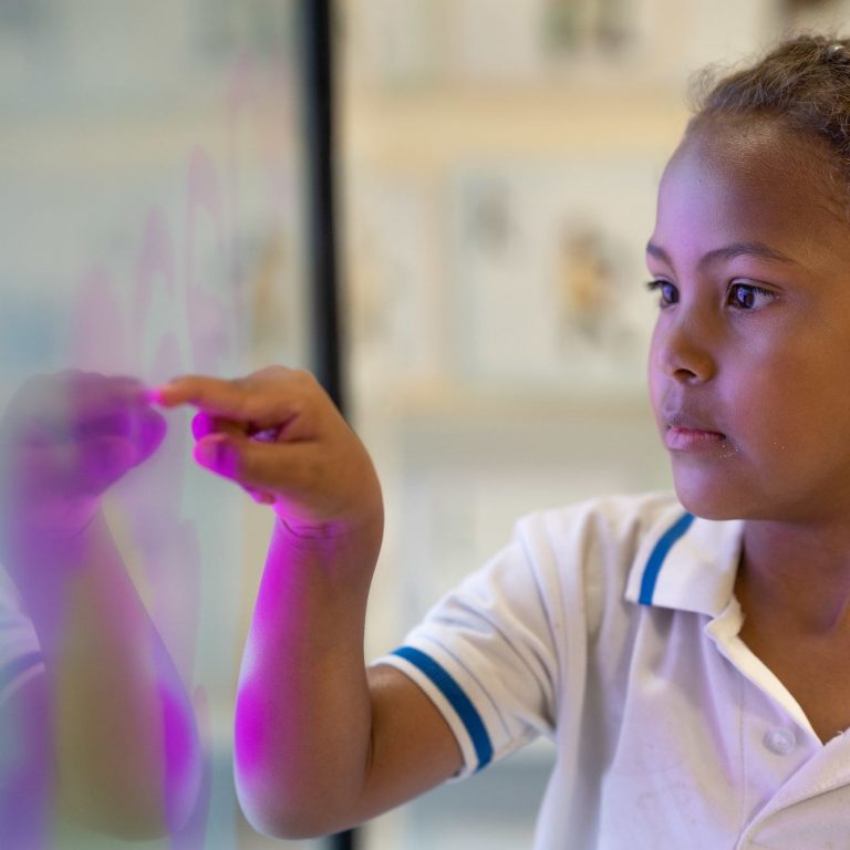 girl writing on a board