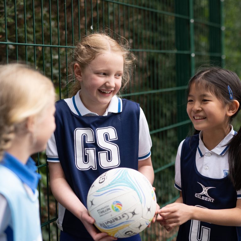 girls holding a ball