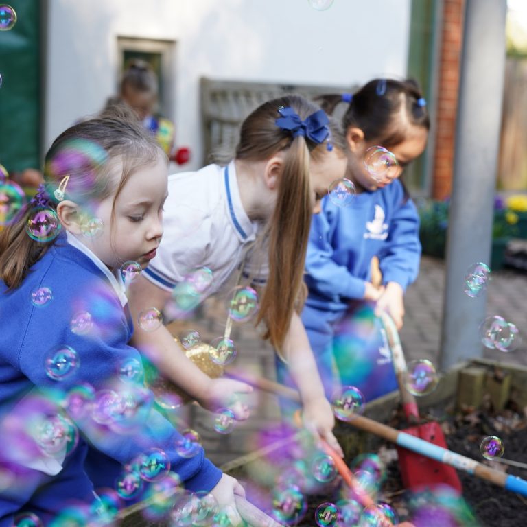 girl playing with bubbles