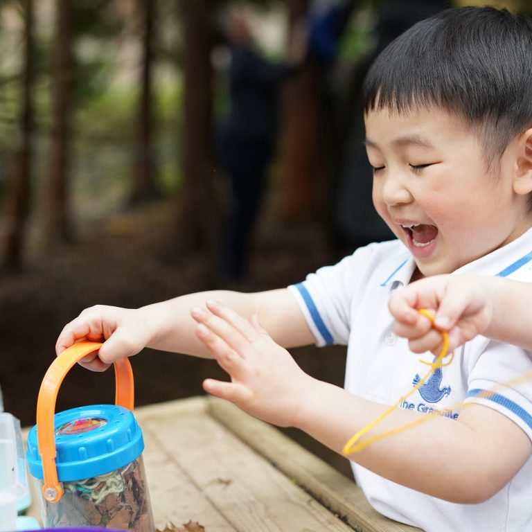 boy holding a pot