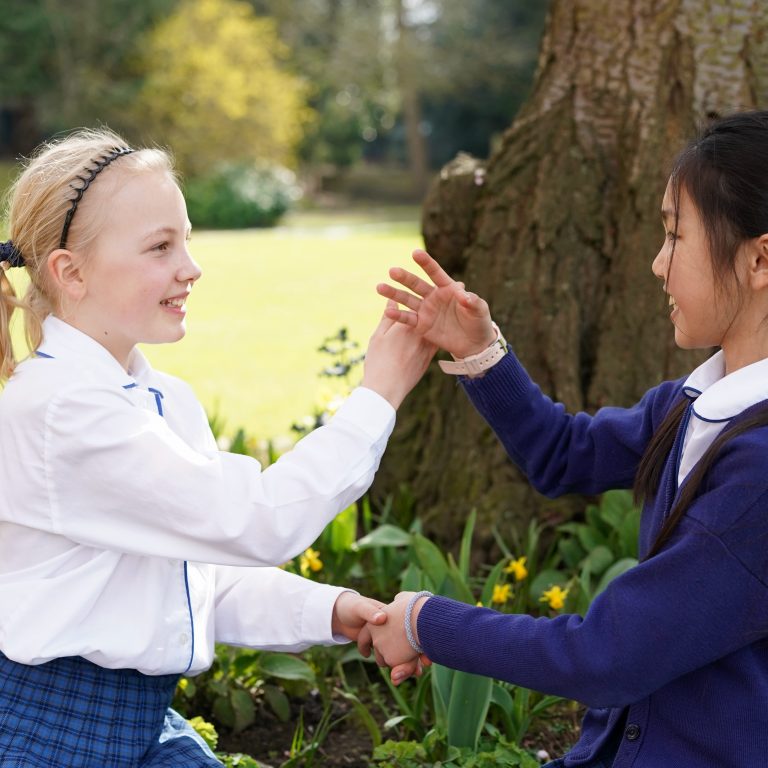 girls doing a hand shake