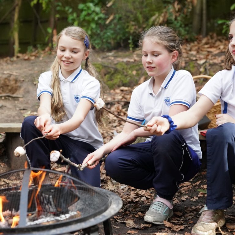 students toasting marshmallows