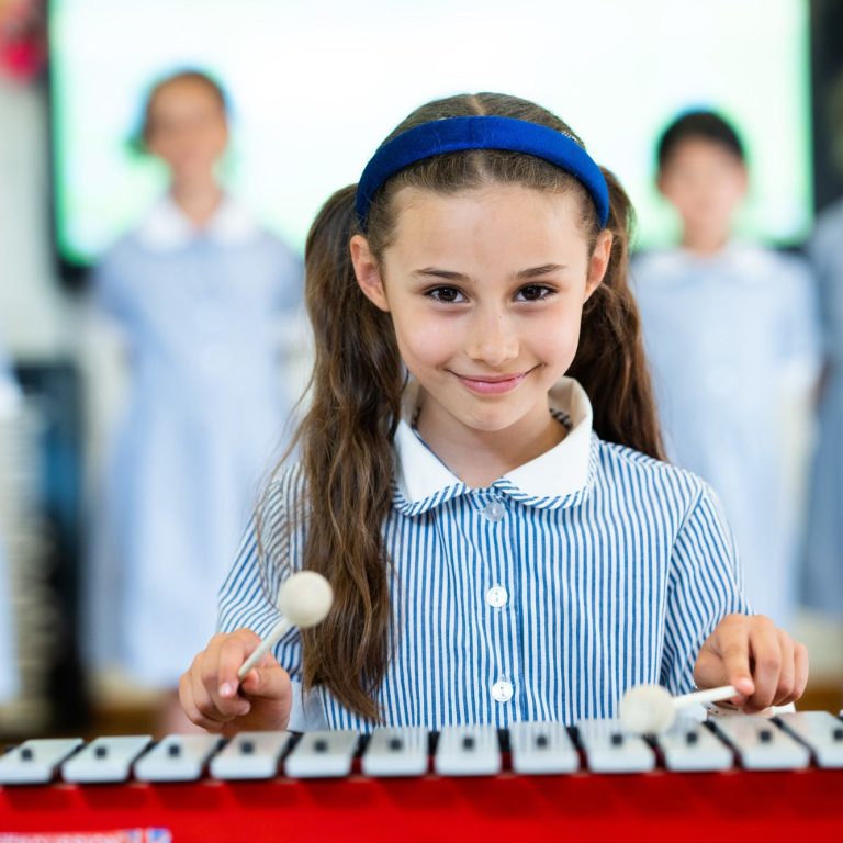 girl playing an instrument