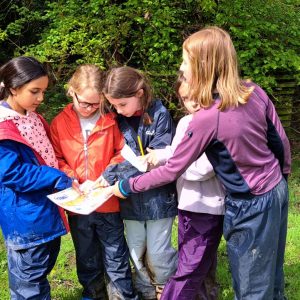 children using a map