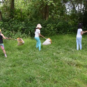 children holding large nets