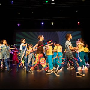 children performing on stage