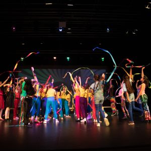 children performing on stage