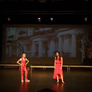 children performing on stage