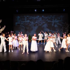 children performing on stage