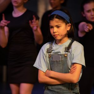 children performing on stage