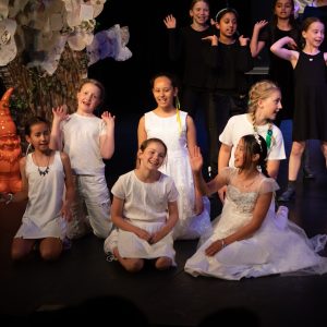 children performing on stage
