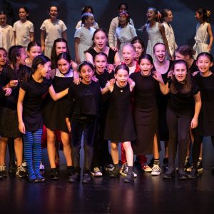 children performing on stage