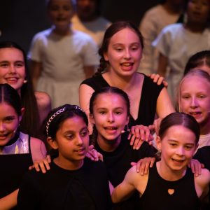 children performing on stage