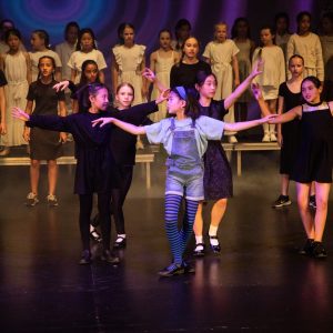 children performing on stage