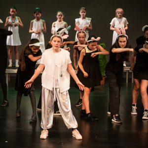 children performing on stage