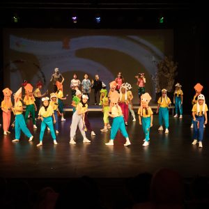 children performing on stage