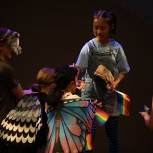 children performing on stage