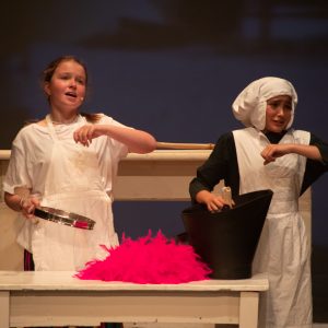 Young pupils performing on stage