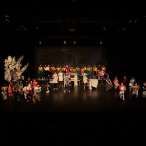 children performing on stage