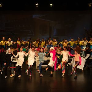 children performing on stage