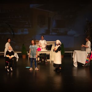 children performing on stage