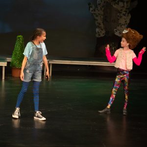 two pupils on stage