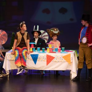 children performing on stage