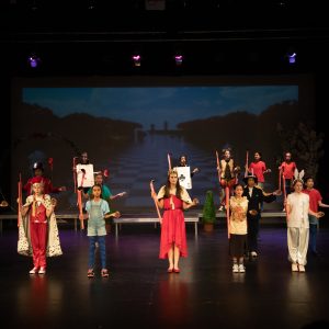 children performing on stage