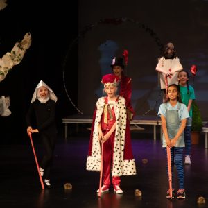children performing on stage