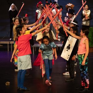 children performing on stage