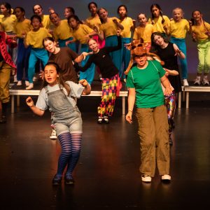 children performing on stage