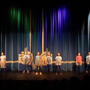 children performing on stage