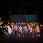 children performing on stage